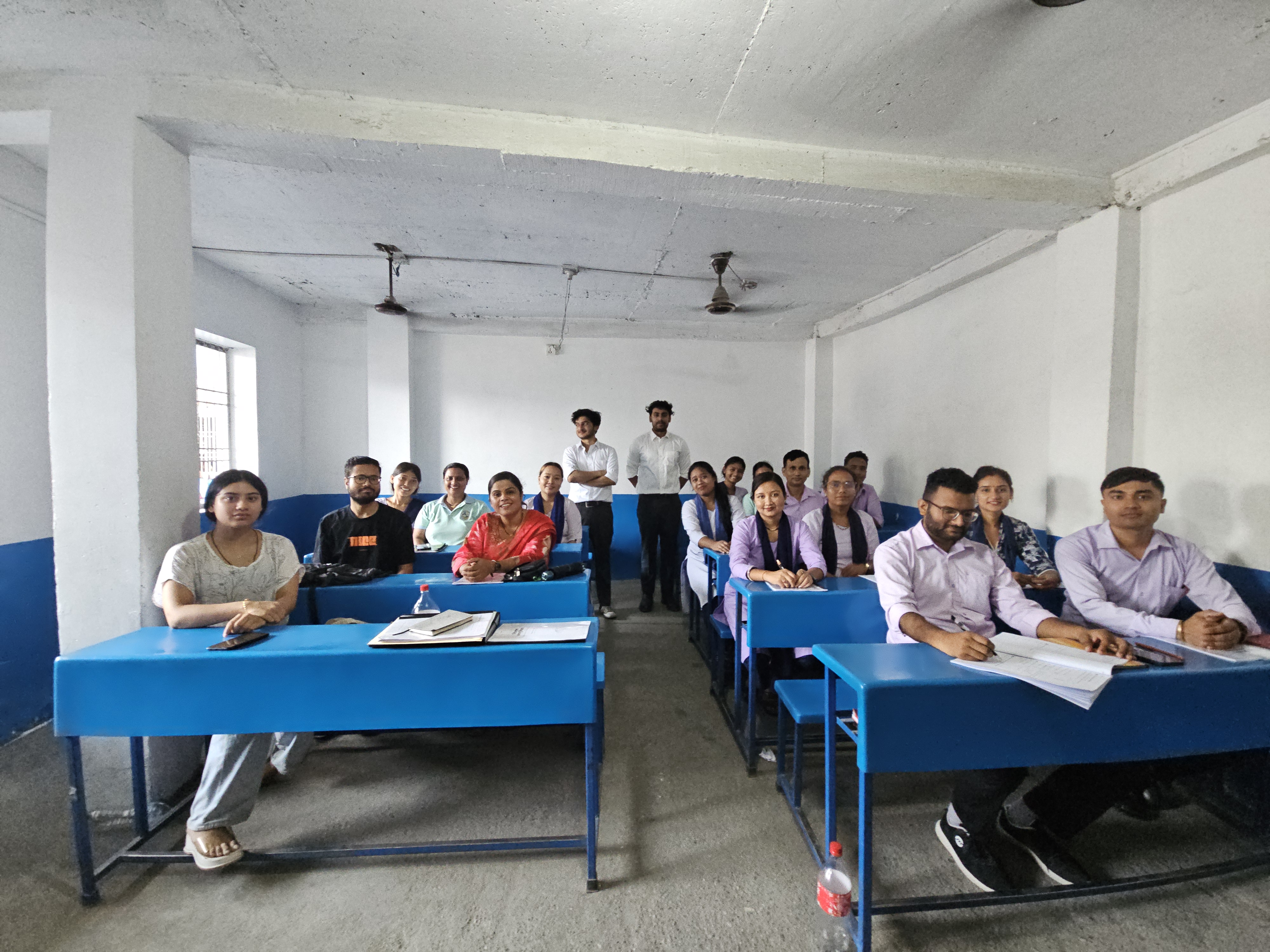 Teachers at blue desks